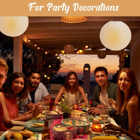Jumbo 30 Inch White Paper Lanterns Hanging Luminaries For Weddings And Events lighting up an evening outdoor dinner party.