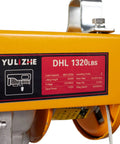 Close-up of Electric Hoist 1320 Lbs Winch With Remote Control 110V Lift System label showing specifications in garage equipment.