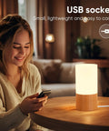 Cozy Beech Wood Table Lamp With Dimmable LED Light on nightstand, USB-powered, providing eye friendly soft glow for relaxing evenings