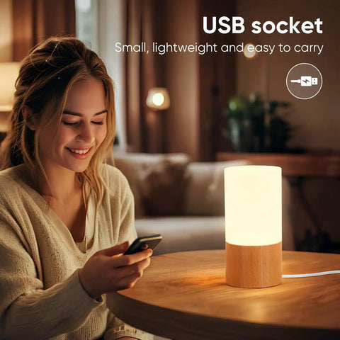 Cozy Beech Wood Table Lamp With Dimmable LED Light on nightstand, USB-powered, providing eye friendly soft glow for relaxing evenings