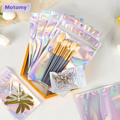 Holographic Packaging Bags 3.1x4.7 Inch Resealable Foil Mylar Pouches with makeup brushes and key rings, durable and clear shine.