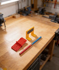 Magnetic Cabinet Hinge Mounting Clamp Pro Grade Heavy Duty ABS Tool on workshop table with positioning aid and pen
