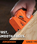 Shop Tough O1 Steel Chamfer Plane With Four Swappable Corner Edging Cutters For Buttery Smooth Wood Trimming And Top Shelf Detail Finishes Plus Dead Easy Built In Storage Keeps Your Garage Gear Tidy And Ready For Any Big Weekend Build. Close-up of an orange chamfer plane used for trimming wood edges.