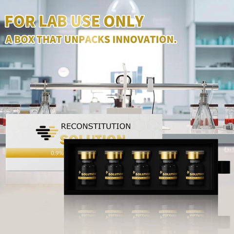 Five 5mL glass vials with gold caps in a black tray, labeled Reconstitution Solution.