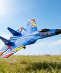 Su-27 Inspired RC Fighter Jet For Adults And Beginners in flight over grassy field, durable lightweight foam airplane in blue color