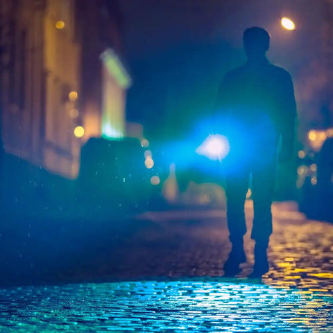 Silhouette of person using Flateye High Performance Flashlight With Cree LED Multi Position Beam Waterproof And Shockproof 1700 Lumens