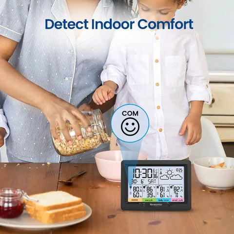 Four Zone Wireless Indoor Outdoor Weather Station With Digital Atomic Clock And Temperature Humidity Monitor, Real Time Readings Across Home Nursery Basement And Backyard, Backlit Display, Weather Forecast, Black on kitchen counter