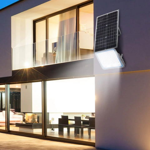 Two Pack 300W Solar Flood Lights Outdoor Security Lamps With 24,000 Lumens LED, IP67 Waterproof on modern house wall.
