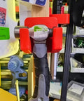 Dual Hammer Holder Wall Mount Set for Garage and Workshop with hammer secured in red holder on a wooden beam