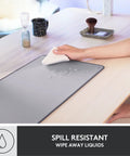 Studio Series Desk Mat Large Extended Desk Pad With Anti Slip Base Spill Resistant Durable Design Soft Cloth Surface Protects Your Desk For Home Office And Workstation Mid Gray, being wiped dry.