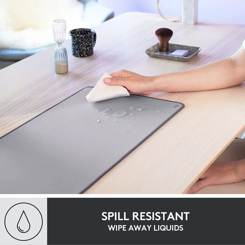 Studio Series Desk Mat Large Extended Desk Pad With Anti Slip Base Spill Resistant Durable Design Soft Cloth Surface Protects Your Desk For Home Office And Workstation Mid Gray, being wiped dry.