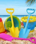 Heavy Duty 16 Inch Beach Shovel Set Of 3 For Kids And Adults, rugged plastic sand diggers in pink, yellow, and blue on sandy beach
