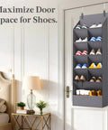 Six Tier Over The Door Shoe Organizer With Deep Fabric Pockets Keeps Your Kicks Neat Holds Up To 12 Pairs Of Sneakers And Boots For Bedroom Closet Or Dorm Room Organization In Gray hanging on a door with assorted shoes visible.
