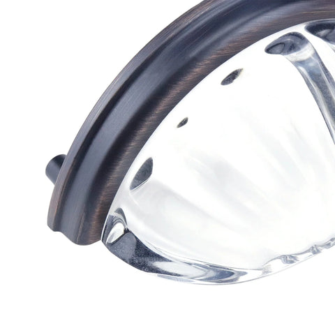 Close-up of Three Inch Hole Centers Clear Glass Cabinet Cup Pulls with Scalloped Crystal Glass and Oil Rubbed Bronze Base.