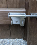 Sliding Latch 6 Inch Thick Stainless Steel Bucket Bolt With Padlock Hole Brushed Finish installed on wooden gate
