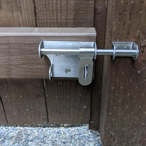 Sliding Latch 6 Inch Thick Stainless Steel Bucket Bolt With Padlock Hole Brushed Finish installed on wooden gate