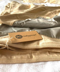 EMF Shielding Large Bed Blanket Made From Organic Cotton With Silver Lining For Daily Sleep Protection folded on a bed