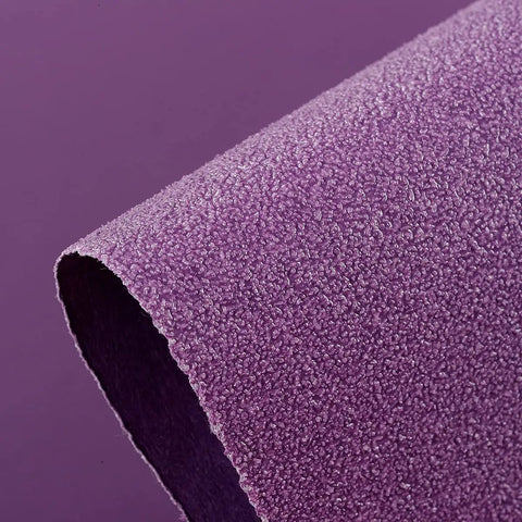 Close-up of 600 Grit Wet Dry Sanding Sheets 9 By 11 Inch Set showing textured purple surface with white fused alumina abrasive.