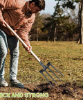 Person using Heavy Duty 11 Inch Four Prong Steel Pitch Fork Replacement Head For Soil Loosening And Ground Prep In Farming And Landscaping Tools