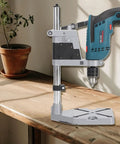 Adjustable Electric Drill Press Stand And Holder Bracket For Workbench Clamp Tool Station Lightweight Aluminum Alloy mounted on a wooden table.