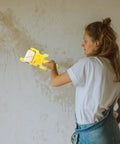 Pro Paint Edger Roller Kit with Extension Pole and Replacement Brush for Sleek Baseboard and Trim Lines in use on wall.