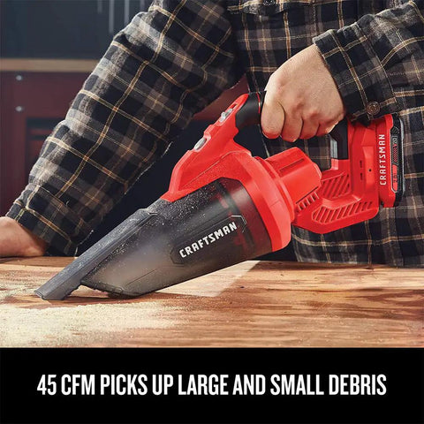 Person using V20 Cordless Hand Vacuum With 45 CFM Power Two Stage Filtration for quick cleanups, showing debris pickup efficiency.