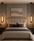 Alabaster Pendant Lights, Smoky Gray Glass Pendant Light Fixtures in a modern bedroom above the bed.