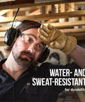 Person wearing WorkTunes Connect Wireless Hearing Protector With Bluetooth Technology And AM FM Radio 26 Decibels NRR