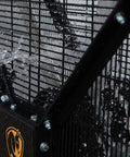 Close-up of OSHA certified safety cage on Crush The Summer Heat With This 6 Foot Industrial Mobile Floor Fan in black with water droplets.