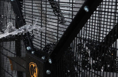 Close-up of OSHA certified safety cage on Crush The Summer Heat With This 6 Foot Industrial Mobile Floor Fan in black with water droplets.