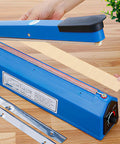 Hand sealing machine with khaki cloth-covered heating strip being inserted. Top Shelf Replacement Heating Strip For Hand Sealer Two Pack Cloth And Tungsten Wire 2Mm Heat Element For Vacuum Shrink Wrap Bags Safe Fast Resealing Upgrade Your Packaging Machine.