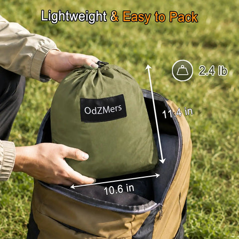 Person packing Army Green Two In One Pop Up Hammock Tent With Mosquito Net For One Person into backpack, showing size dimensions.