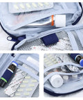Close-up of 4 Pack Travel First Aid Pouches Durable 600D Oxford Exterior Grab And Go Ready Portable Outdoor Medical Bags, open view with supplies.