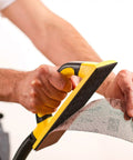 Person using Pro Grade Dust Free Hand Sanding Block Kit 3 In X 9 In With Hook And Loop Backing, 55 Hole Abranet Mesh Sheets, Vacuum Hose