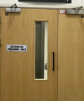 Aluminum Door Sign 9x3 Inches Self Adhesive Waterproof Office Sign for Authorized Personnel Only on wooden door.