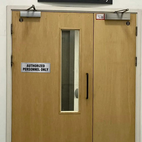 Aluminum Door Sign 9x3 Inches Self Adhesive Waterproof Office Sign for Authorized Personnel Only on wooden door.