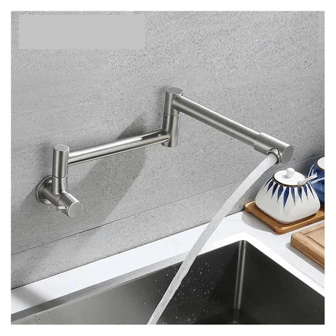 Foldable Wall-Mount Kitchen Faucet - Brushed Stainless Steel, water flowing into sink with modern design and sleek finish.