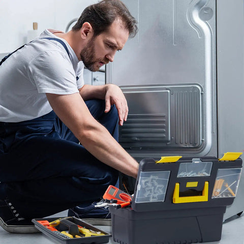 Man using Four Piece Portable Toolbox Set With Built In Latch Tray And Magnetic Wristband For Home And Pro Repairs Includes Removable Compartments