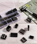 52 Shapes Leather Hole Punch Tool Set with Cutter and Carving Hammer displayed on a table with various punch shapes and open case.