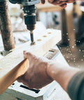 Worker using Sixteen Piece Forstner Bit Set For Woodworking, Pro Grade Precision Carbon Steel Drill Bits on wood for clean holes.