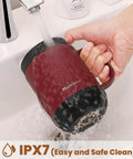 Smart Self Heating Coffee Mug With Precise Temperature Control And Marathon Battery Life being rinsed under water. IPX7 waterproof design.