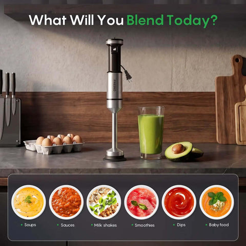 Total Game Changer Handheld Immersion Blender With Titanium Coated Blades And Variable Speed Trigger on kitchen counter with green smoothie.