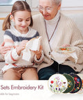 Child and elderly woman working on Four Pack Embroidery Kit For Beginners And Adults DIY Starter Set With Flower Patterns Cross Stitch