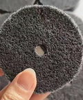 Close-up of eight pack three inch nylon fiber buffing wheel with three eighths inch arbor for bench grinder and die grinder