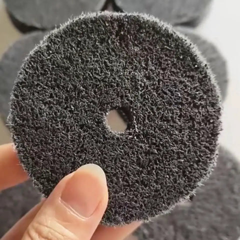 Close-up of eight pack three inch nylon fiber buffing wheel with three eighths inch arbor for bench grinder and die grinder