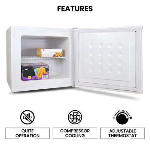 Hella Solid Upright Freezer One Point Two Cubic Feet White Compact Frost Vault With Wire Rack Garage Ready Meat Storage Box interior with shelf and storage items.