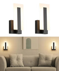 Top Shelf Modern Led Wall Sconces Set Of Two Up And Down Black Metal Fixture With 3000K Warm White Glow installed above a couch.