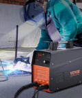 Pro Spec 50 Amp Plasma Cutter With Non-Touch Pilot Arc Torch, Dual Voltage 110V And 220V IGBT Inverter in use with sparks flying.