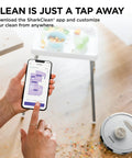 Stratos 2 In 1 Robot Vacuum And Mop with NeverTouch Self Cleaning Base shown near a messy floor with phone app control