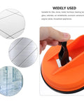 Heavy Duty Suction Cup Lifter With Dual Grippers For Glass And Metal Panels Up To 132 lbs, showcasing vacuum grip on smooth surfaces.
